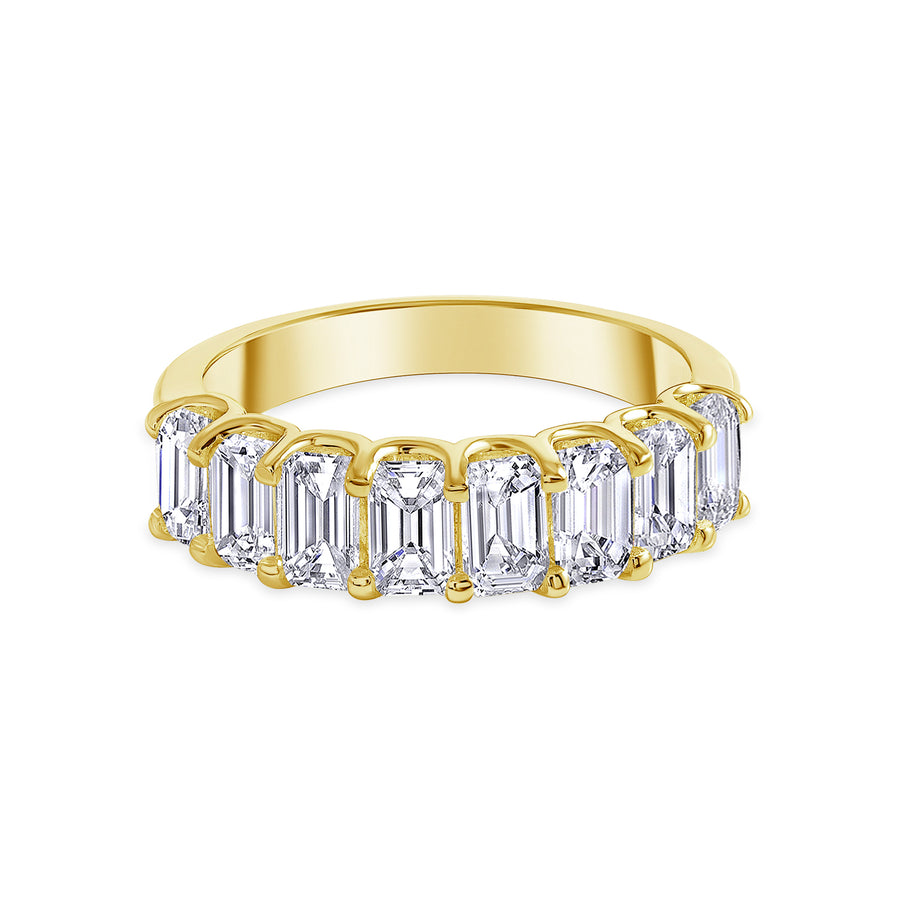 emerald half eternity ring gold